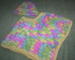 250 Fuzzy poncho and bonnet set in beautiful pastel colours