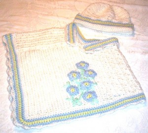 Forget-me-not poncho and matching bonnet Forget-me-not poncho and matching bonnet
